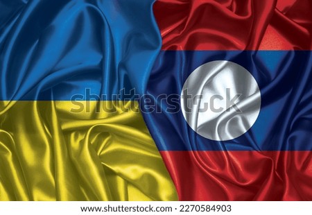Ukraine and Laos two folded silk flags together