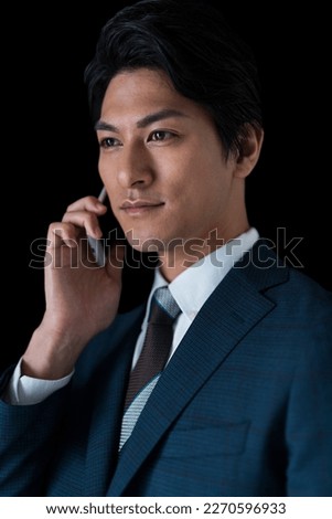Image of a businessman making a phone call