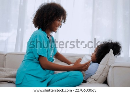 Smiling african american female doctor talking to teen patient  tell about medicine at medical clinic checkup appointment or home care.