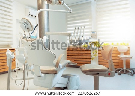 Modern dental practice. Dental chair and other accessories used by dentists Royalty-Free Stock Photo #2270626267