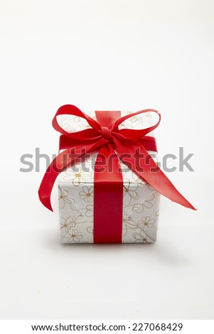 red Gift box with ribbon and bow isolated on the white background