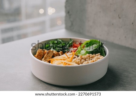 Food on an elegant white plate, lunch or dinner dish. Delicious food in a restaurant close-up. Royalty-Free Stock Photo #2270691573