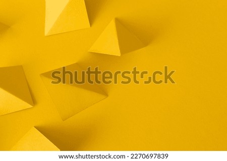 Abstract yellow background with triangle geometric shapes