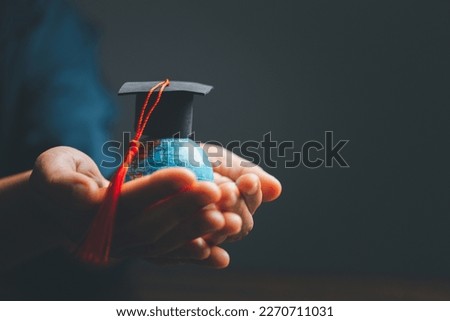 Graduation cap with Earth globe. Concept of global business study, abroad educational, Back to School. Education in Global world, Study abroad business in universities in worldwide. language study Royalty-Free Stock Photo #2270711031
