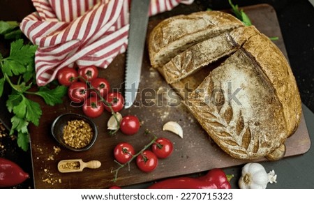 Fresh baked bread on the table - still life. Royalty-Free Stock Photo #2270715323