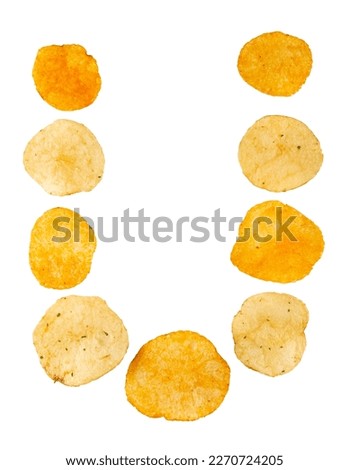 Letter U made of potato chips and isolated on white background. Food alphabet concept. One letter of the set of potato chip font easy to stacking.