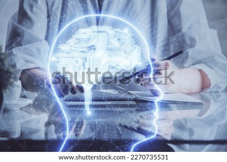 Multi exposure of writing hand on background with brain hologram. Concept of self learning.