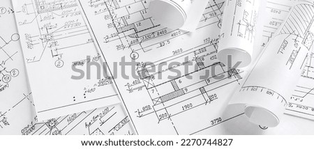 Architects concept, engineer architect designer freelance work on start-up project drawing, construction plan architect design working drawing sketch plans blueprints and making construction model Royalty-Free Stock Photo #2270744827