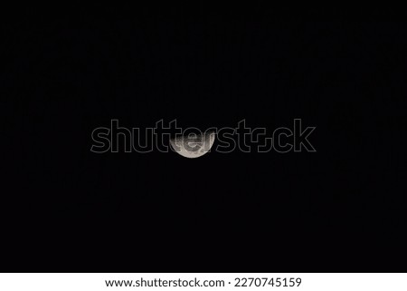 selective focus picture of a beautiful half moon
