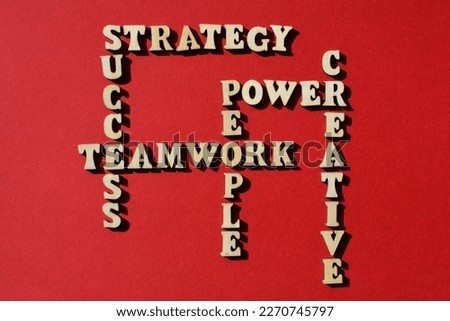 Strategy, Success, Teamwork, People Power, Creative, words in wooden alphabet letters in crossword form isolated on red background