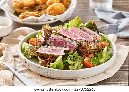 seared ahi tuna tataki salad on plate Royalty-Free Stock Photo #2270752263