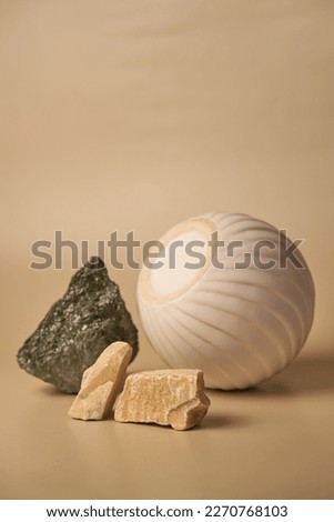 Beige and green stone and a ceramics round podium on a beige background, natural product display mockup, pedestal for your product advertising. Hight quality photo