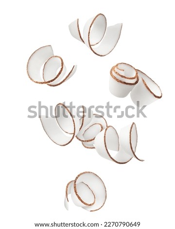 Falling Coconut curls, shavings, isolated on white background, clipping path, full depth of field Royalty-Free Stock Photo #2270790649