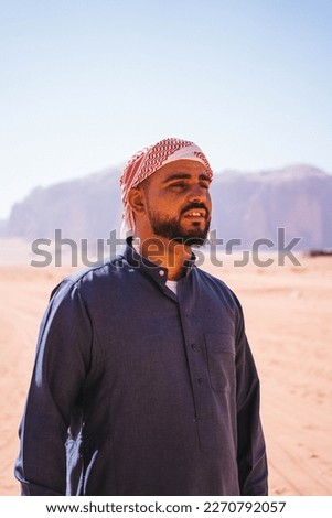 Young Arab Jordanian Bedouin Man Portrait In Wadi Rum Desert, Jordan Royalty-Free Stock Photo #2270792057
