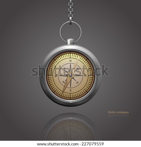 retro silver compass hanging on a chain. Stock