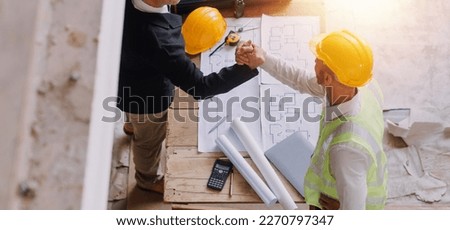 Two business man construction site engineer. Engineering objects on workplace with partners interacting on background Royalty-Free Stock Photo #2270797347