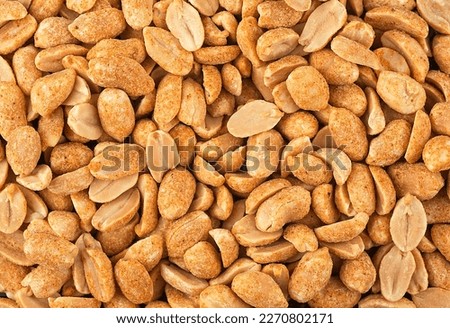 Spicy peanuts pile as background, top view. Chili spicy peanuts. Royalty-Free Stock Photo #2270802171