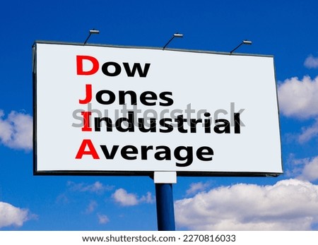 DJIA Dow Jones industrial average symbol. Concept words DJIA Dow Jones industrial average on big billboard against beautiful blue sky. Business DJIA Dow Jones industrial average concept. Copy space Royalty-Free Stock Photo #2270816033