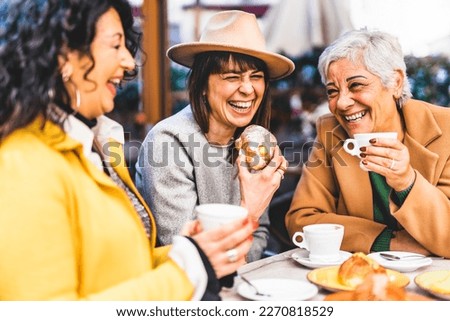 Group of senior women at bar cafeteria enjoying breakfast drinking coffee and eating croissant - Life style concept - Mature female having fun at bistrò cafe and sharing time together Royalty-Free Stock Photo #2270818529