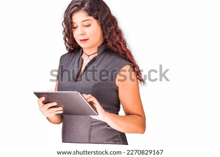venezuelan latin mid businesswoman happy with tablet internet communication technology. programmer