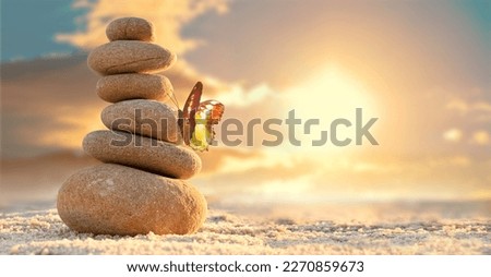 Stone tower. Natural pebble stone on the beach. Balancing body, mind, soul and spirit. Mental health practice.