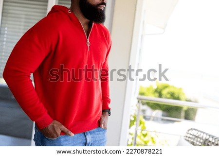 African american man wearing red sweatshirt with copy space. Fashion, design, color and clothes concept.