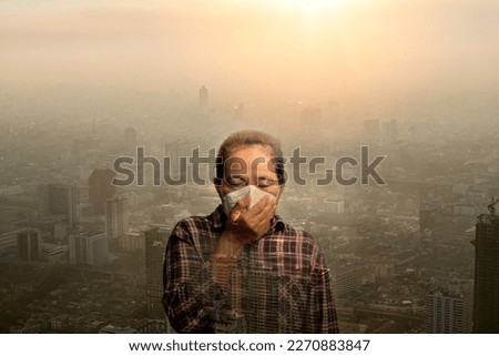 Woman wearing N95 PM 2.5 respiratory protection mask against air pollution and dust particles exceed safety limits. Healthcare, environmental, ecology concept. Allergy, headache. air danger in city. Royalty-Free Stock Photo #2270883847
