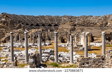 Scenic view of preserved ruins of ancient Roman theater in city of Side on sunny spring day, Turkey..