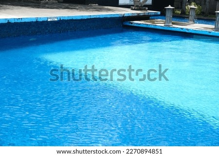 the blue swimming pool at an inn