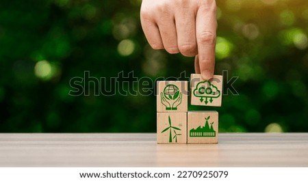 CO2 emission reduction concept, businessman with environmental technology Icons, global warming, sustainable development, renewable energy business. climate change, carbon capture, storage, reuse Royalty-Free Stock Photo #2270925079