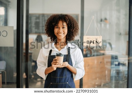 Startup successful small business owner sme woman stand with tablet  in cafe restaurant. woman barista cafe 
