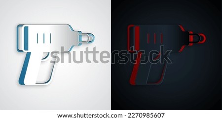 Paper cut Electric cordless screwdriver icon isolated on grey and black background. Electric drill machine. Repair tool. Paper art style. Vector