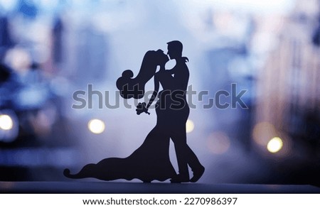 Silhouette of dancing couple in nightclub