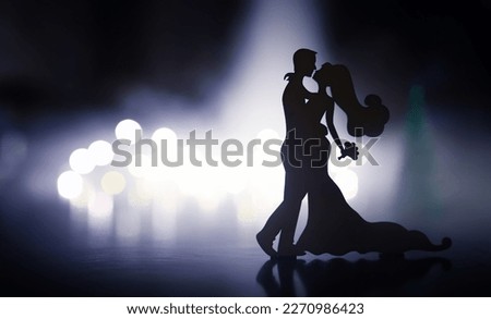 Silhouette of dancing couple in nightclub