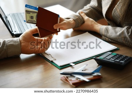 Travel agent receiving money from client for provided service