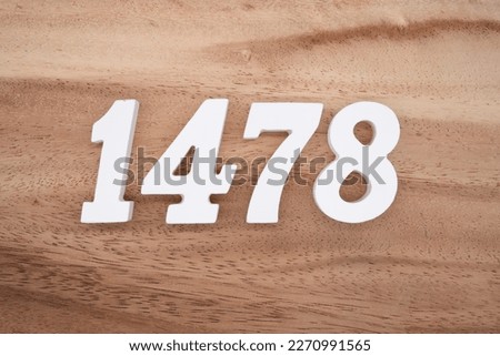 White number 1478 on a brown and light brown wooden background.