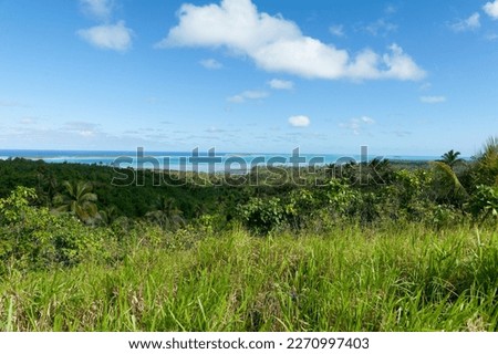 High view across island landscape to South Pacific island coast Royalty-Free Stock Photo #2270997403