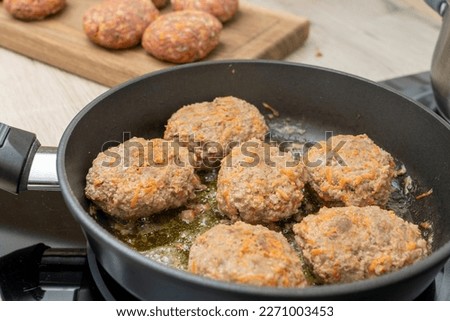 close-up, cooking meatballs in a frying pan, frying pan meatballs. High quality photo