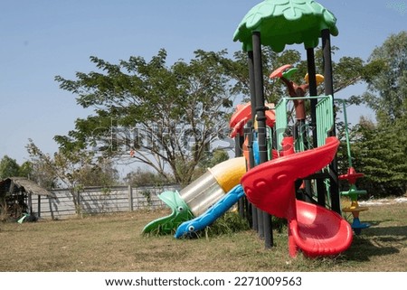 side view of the playground lies an outdoor lawn in the open air