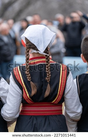 Young girl, wearing Macedonian folklore dress, during bride festival. Braids, hairstyle. Kriva palanka 2023. Macedonia.