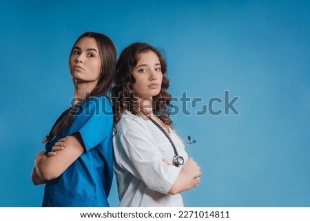 Portrait of young medical staff, studio shoot. Royalty-Free Stock Photo #2271014811