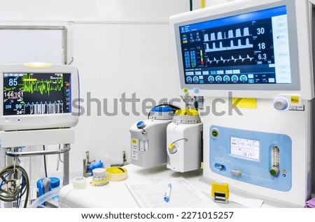 Inhalation anesthetic machine in modern operating room.General anesthesia was done in hospital.Surgery was perform after anesthesiologist worked with patient.Medical instrument in operating theater. Royalty-Free Stock Photo #2271015257