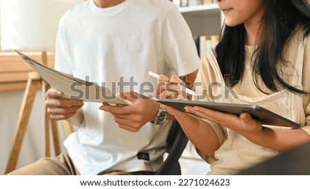 Cropped shot of teacher giving private lessons to teenage student girl. Home schooling children education concept Royalty-Free Stock Photo #2271024623