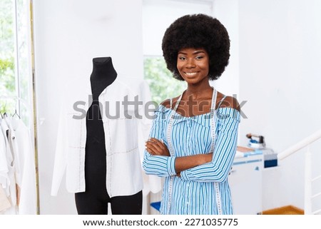 Fashion designer working in a clothing start-up workshop - Clothing tailor working on a new collection Royalty-Free Stock Photo #2271035775