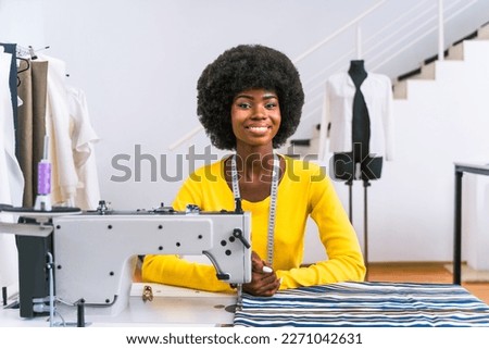 Fashion designer working in a clothing start-up workshop - Clothing tailor working on a new collection Royalty-Free Stock Photo #2271042631