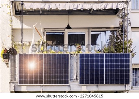 Solar Panel of Modern Apartment Building Balcony in City with Sun light Reflection. Small Local Solar Panel system for Eco Flat. Royalty-Free Stock Photo #2271045815