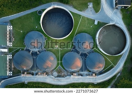 
Vertical view of the process components, fermenters and biogas storage tanks of the agricultural biogas plant. Use of biogas in cogeneration units for electricity and heat production. Royalty-Free Stock Photo #2271073627
