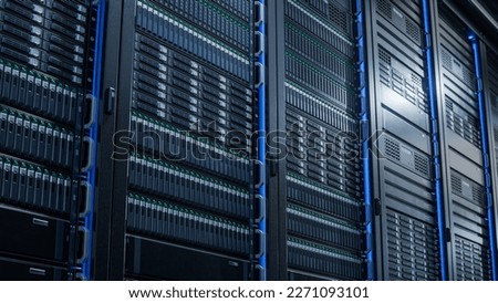 Advanced Cloud Computing Concept. Corridor with Server Racks and Cabinets inside Large Data Center Royalty-Free Stock Photo #2271093101
