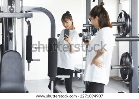Young Asian woman exercising at the gym
