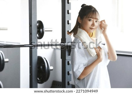 Young Asian woman exercising at the gym
